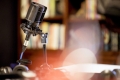 microphone-studio-surrounded-by-equipment-lights-with-blurry-background