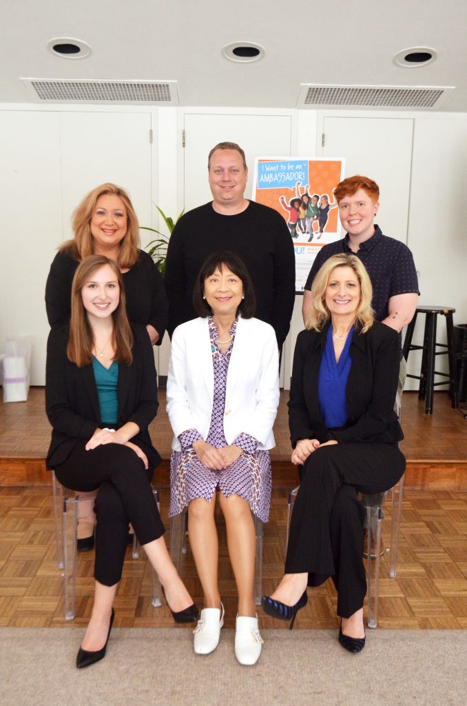 2019 Ambassador team: Back Row L-R: Susan Brozek Scott, Director; Kyle Smith, Assistant Director; Ash Warren, Videography Fellow; Front Row L-R: Camille Traczek, Operations Intern; Hilda Pang Fu, President; Sheila Hyland, Operations Manager.